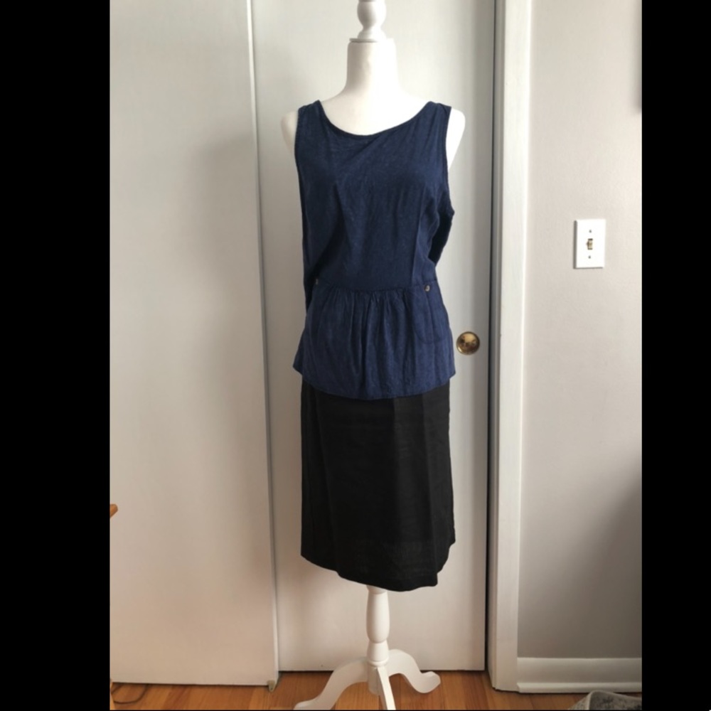 High chest. Low back, loose fitting tank